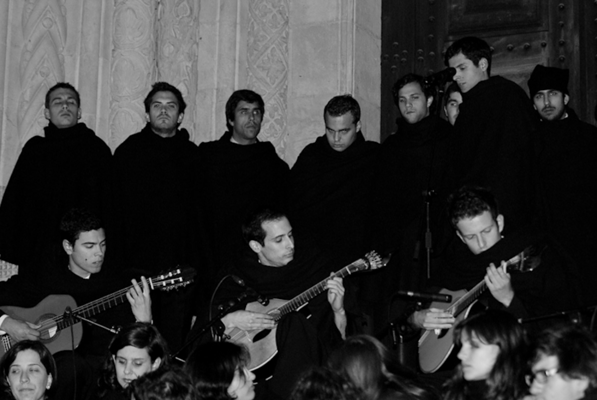 A Coimbra song group performing with Portuguese guitars during a serenade