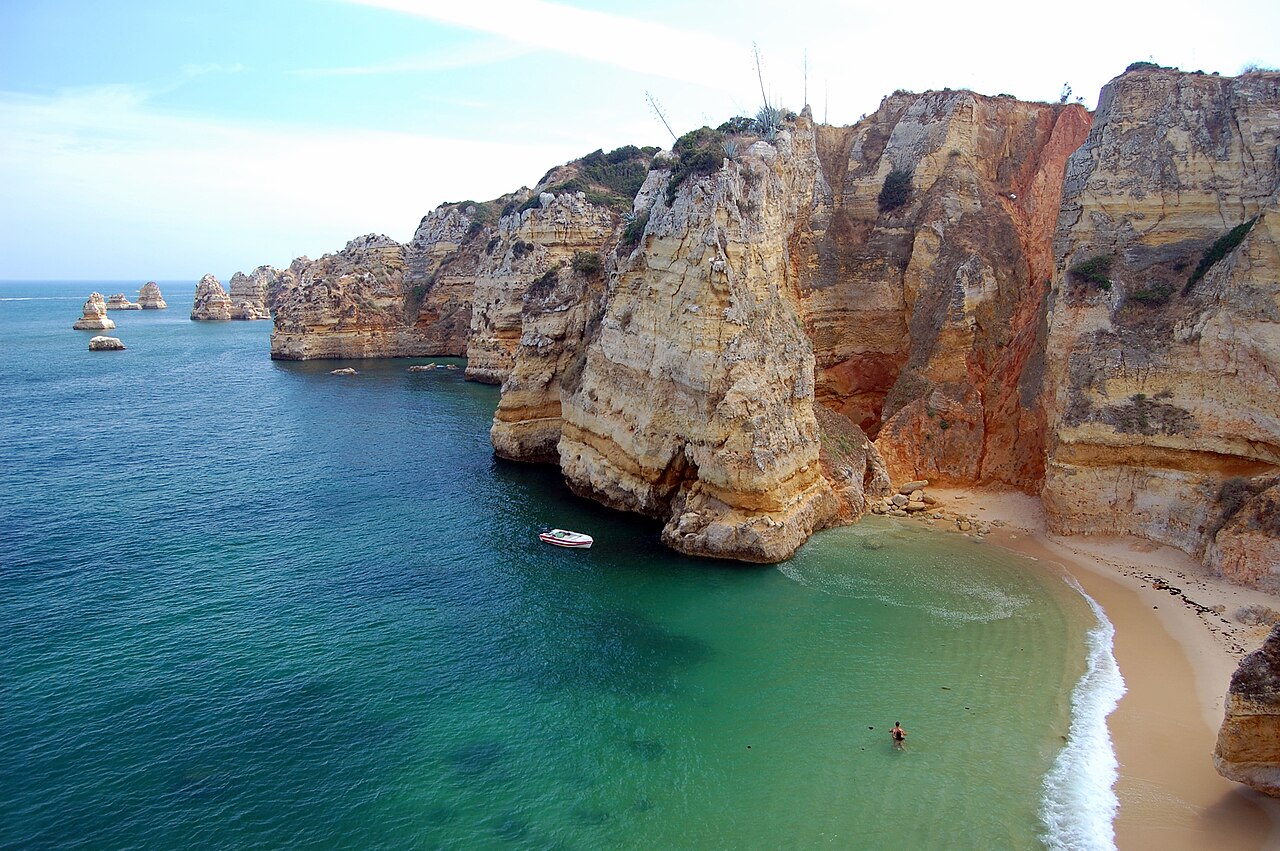 Golden limestone cliffs above Praia Dona Ana near Lagos