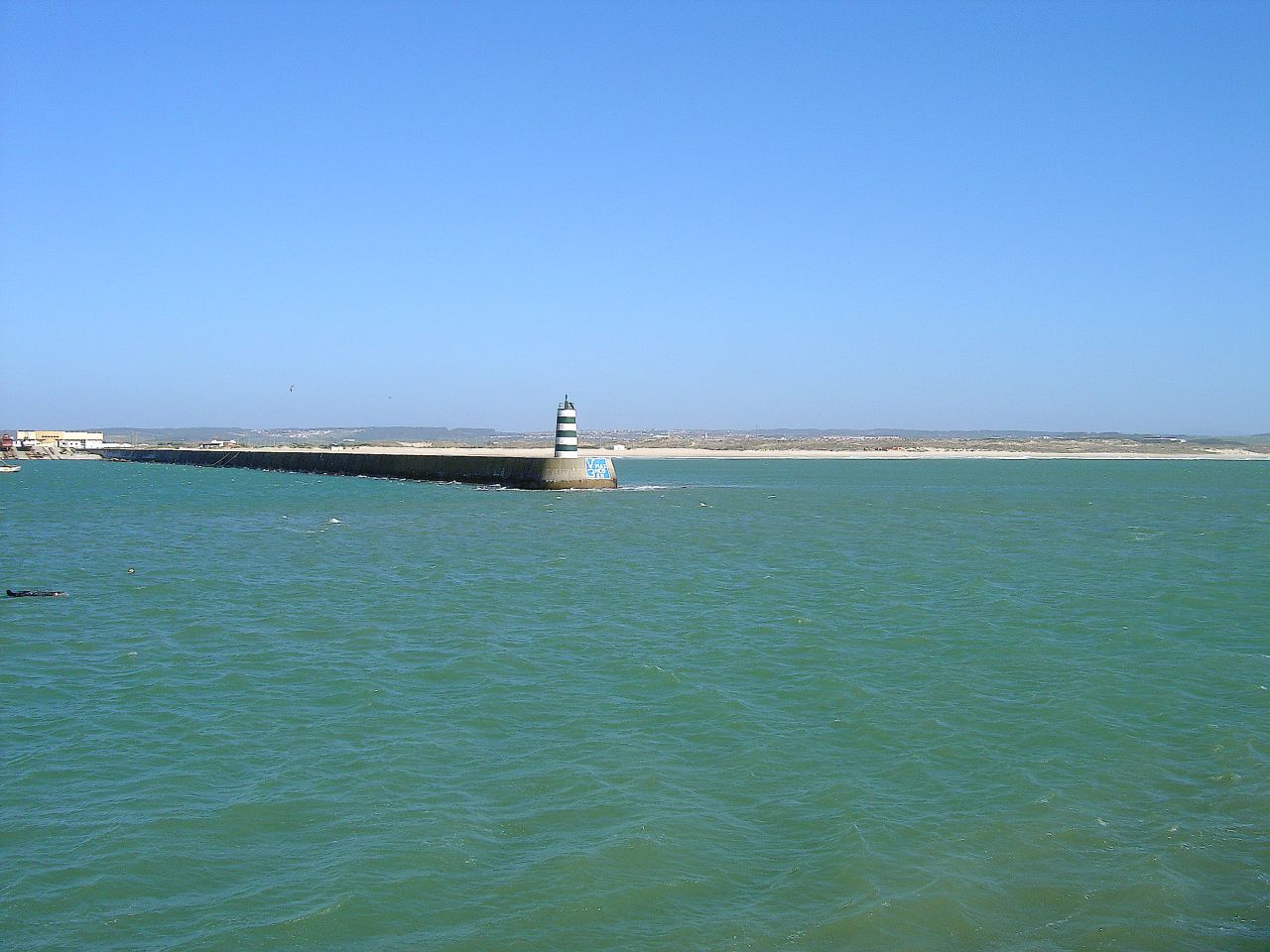 Harbour entrance and striped beacon at Peniche