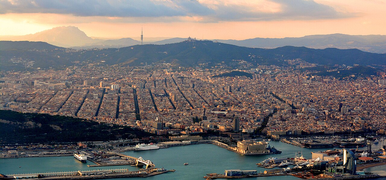 Barcelona and its port in evening light with Montserrat on the horizon